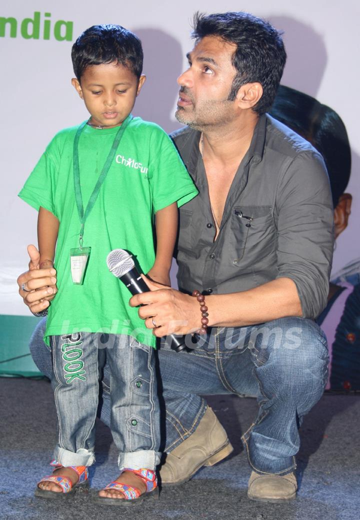 Bollywood actor Sunil Shetty with underprivileged children at the ChildFun day organized by ChildFund India, in New Delhi on Wednesday. .