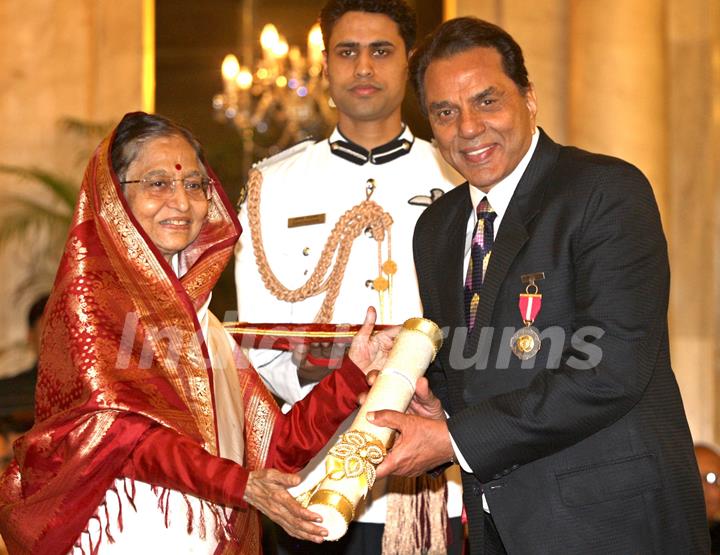 President Pratibha Devisingh Patil, presenting the Padma Bhushan Award to Dharmendra Deol, at Rashtrapati Bhavan, in New Delhi on Wednesday. .