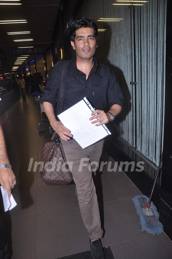 Designer Manish Malhotra leave for London at International Airport. .