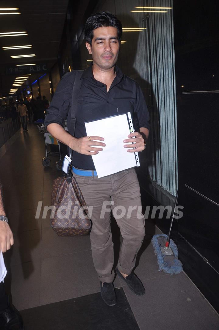 Designer Manish Malhotra leave for London at International Airport. .