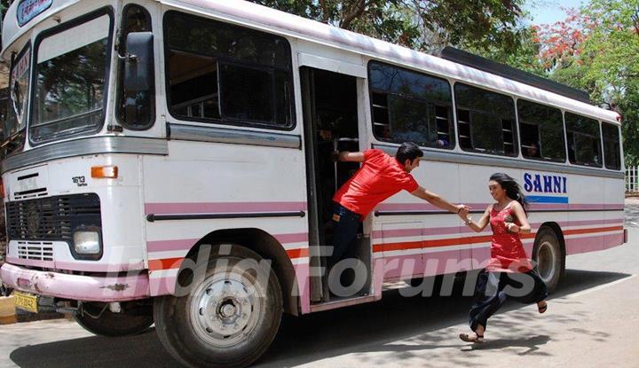 Himansh giving hand to Abigail to get into the bus