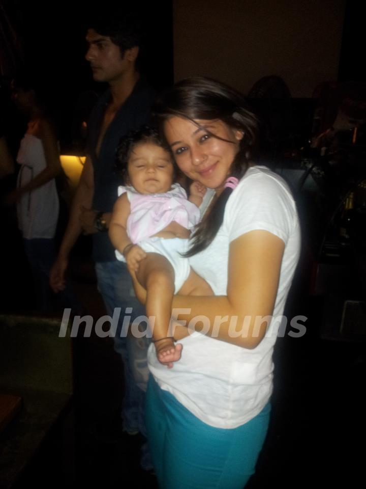 Priyal holding a baby