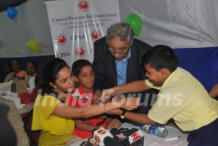 Bollywood actress Mallika Sherawat meets CPAA patients in Mumbai .