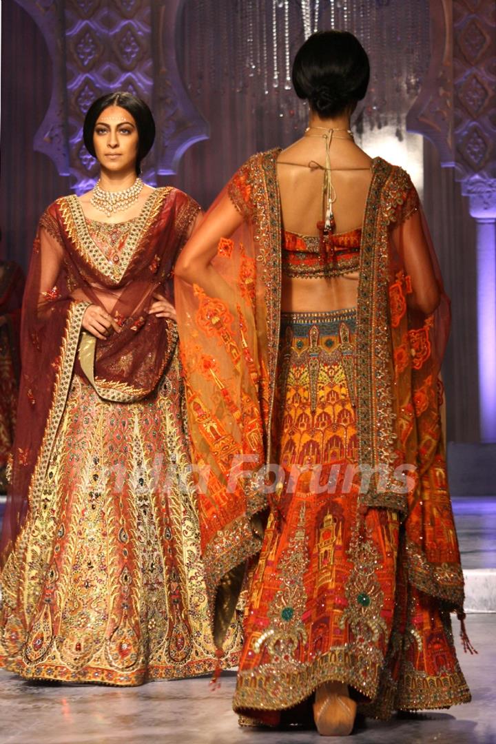 Models showcases a creation by designer JJ Valaya show at the Delhi Couture Week 2012, in New Delhi on Wednesday. .