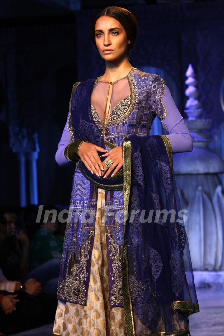 A model showcases a creation by designer JJ Valaya show at the Delhi Couture Week 2012, in New Delhi on Wednesday. .