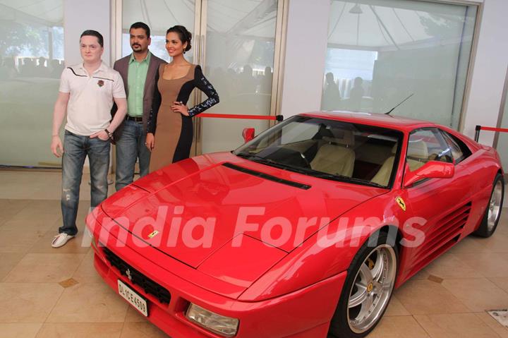 Keertan Adyanthaya, MD, National Geographic Network, Gautam Singhania Chairman of India's Super Car Club and bollywood actress Esha Gupta during a National Geographic Channel  Supercars launch at Blue Sea in Mumbai.