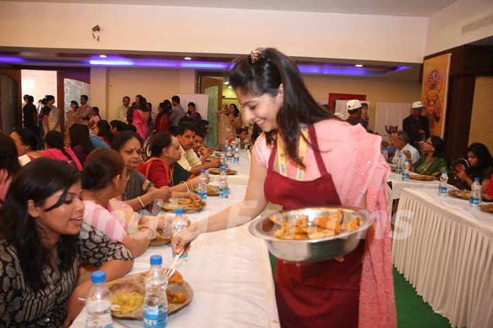 Tanisha serving bhog at North Bombay Sarbojanin Durga Puja 2012 in Juhu, Mumbai.