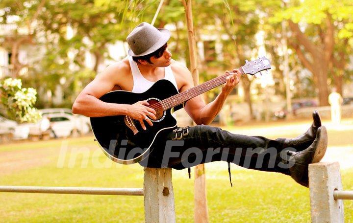 Karanvir Bohra playing Guitar