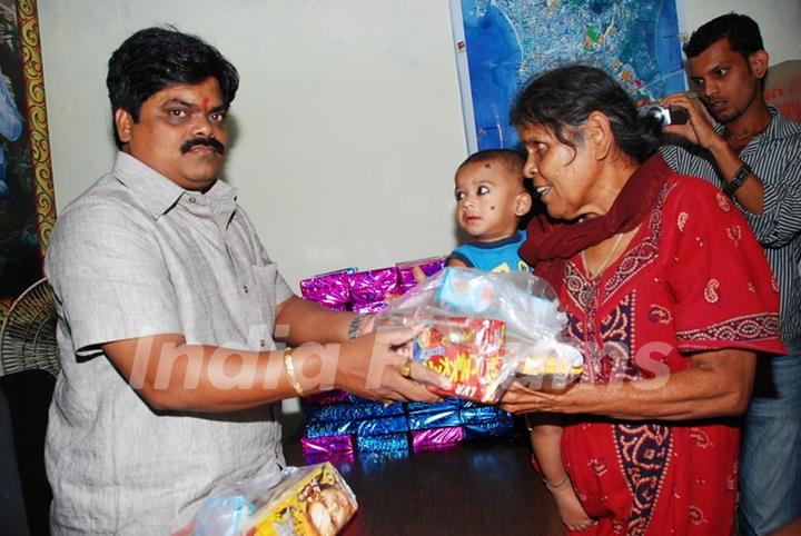 Shankar Nangre distributing Sweets and Fire Crackers to the underprivileged children