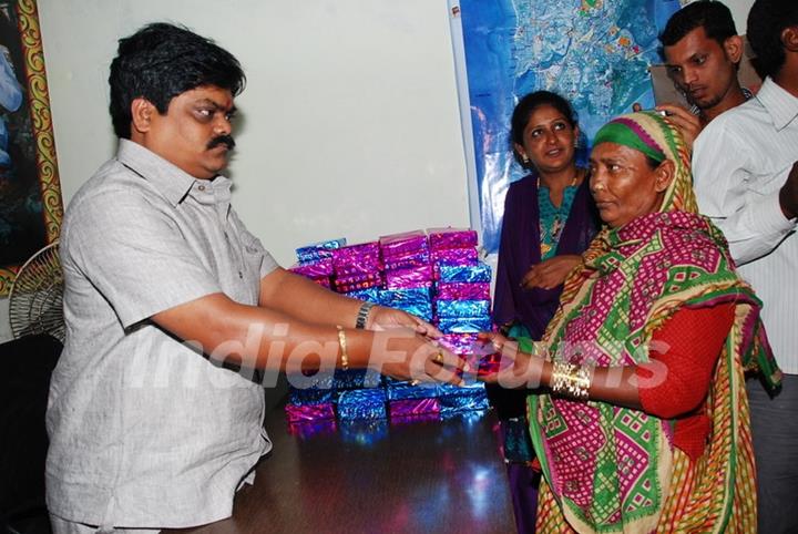 Shankar Nangre distributing Sweets and Fire Crackers to the underprivileged children