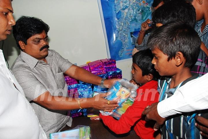 Shankar Nangre distributing Sweets and Fire Crackers to the underprivileged children