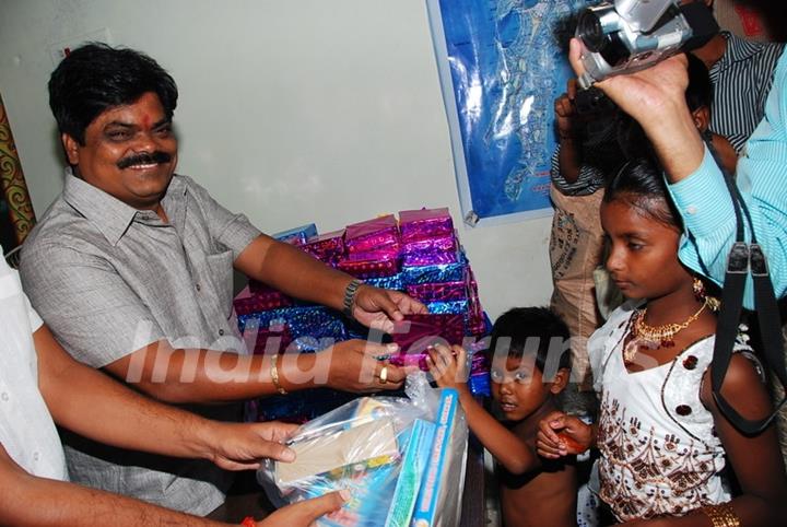 Shankar Nangre distributing Sweets and Fire Crackers to the underprivileged children