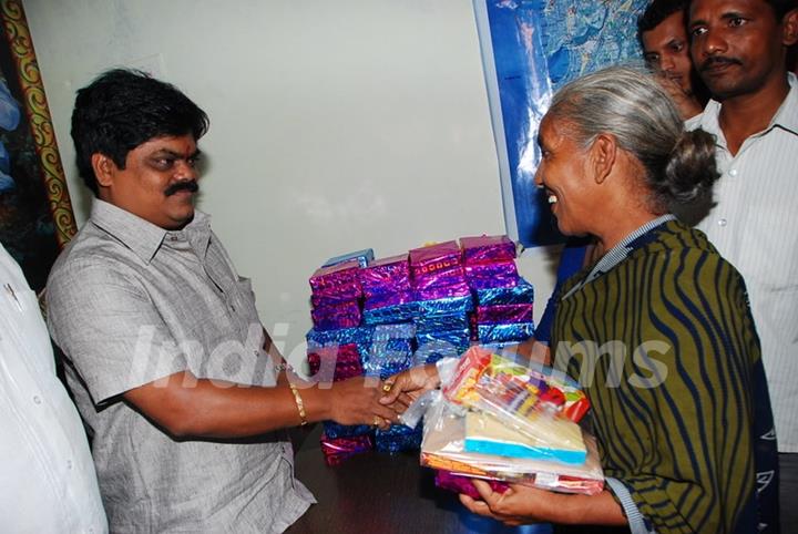 Shankar Nangre distributing Sweets and Fire Crackers to the underprivileged children