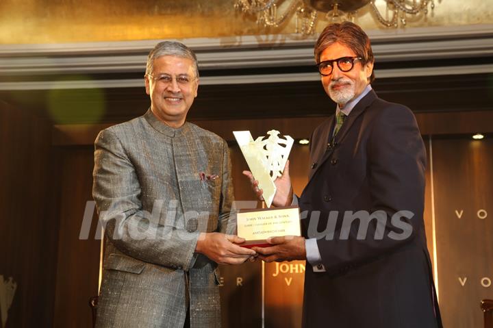 Chief Operating Officer Diageo plc Ivan Menezes honours bollywood actor Amitabh Bachchan as the 'John Walker & Sons Game Changer of the Century' at Hotel Taj Mahal Palace in Colaba, Mumbai.