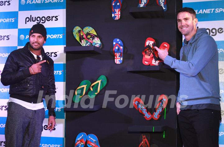 Yuvraj Singh with England cricketer Kevin Peterson at the launch of ''Pluggers'' in Planet Sports, New Delhi.