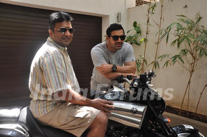 John Abraham gifts his favourite bike to director Sanjay Gupta