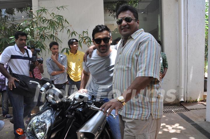 John Abraham gifts his favourite bike to director Sanjay Gupta