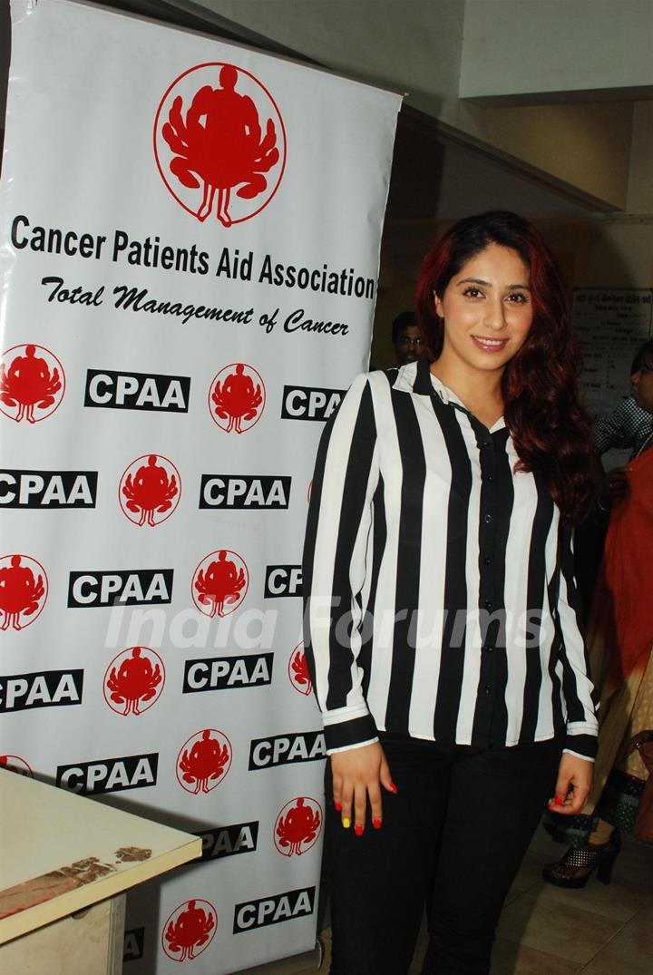 Indian Bollywood actress Neetu Chandra and pop singer Neha Bhasin at a cancer screening camp organised by the Cancer Patient Aid Association (CPAA) with Mumbai
