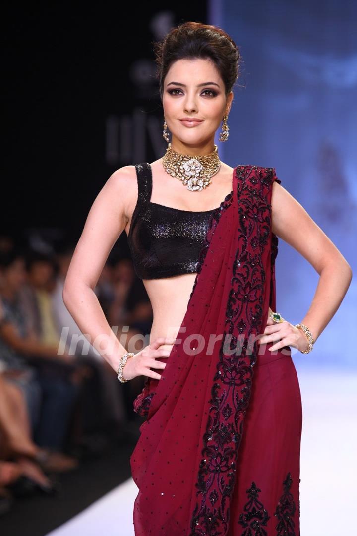 Kristina Akheeva walks the ramp at IIJW 2013 Day 4