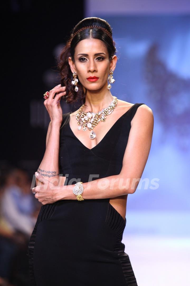 Kristina Akheeva walks the ramp at IIJW 2013 Day 4