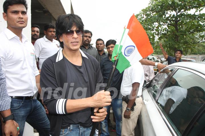 Shahrukh Khan holds the national flag