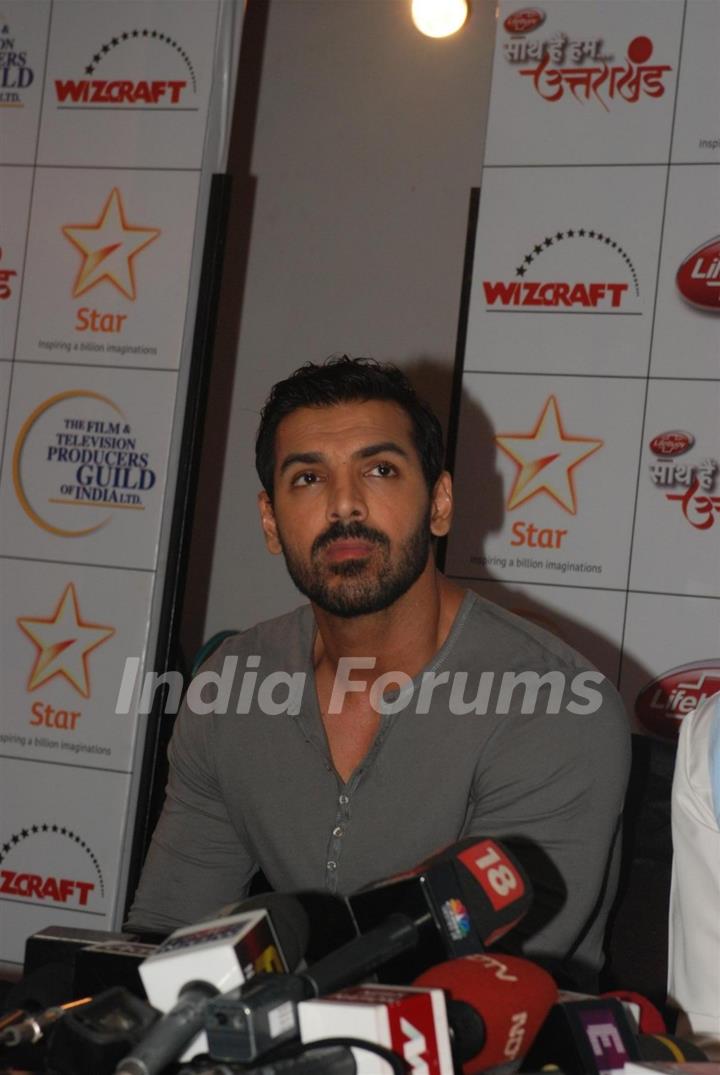 John Abraham patiently listens at the donation drive