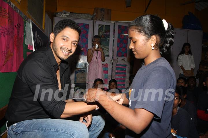 Girls at Akansha tie a rakhi to Shreyas Talpade