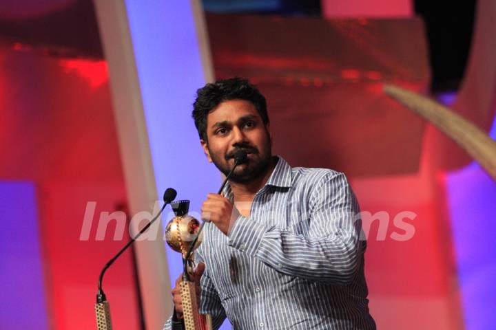 Mithoon Sharma receiving the award for Most popular song at the SAIFTA award ceremony