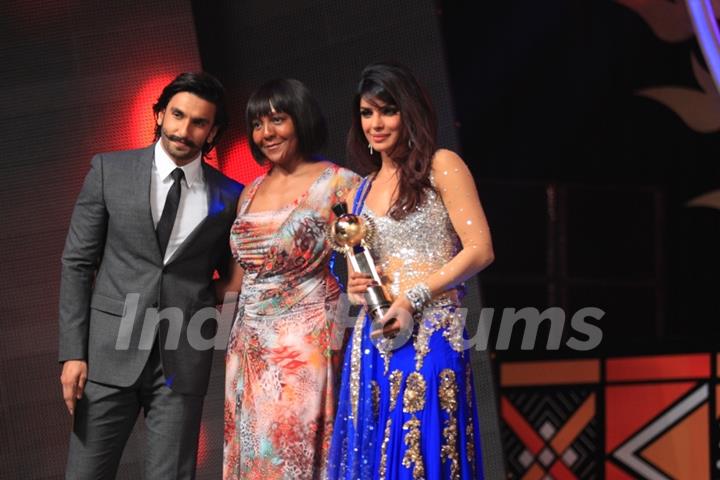 Priyanka Chopra receiving Lead Actor Female Film India by Ranveer Singh & Ndeleka Mandela