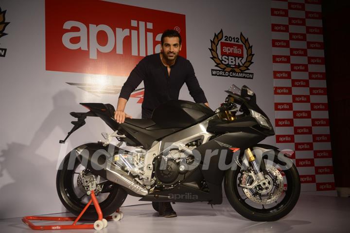 John Abraham poses with his new super bike Aprilia RSV4