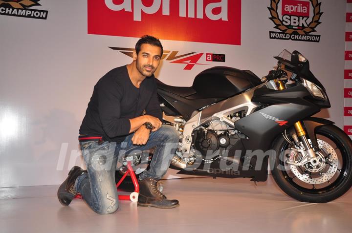 John Abraham poses with his new super bike Aprilia RSV4