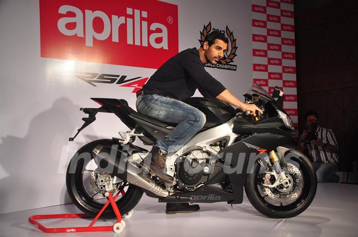 John Abraham poses with his new super bike Aprilia RSV4