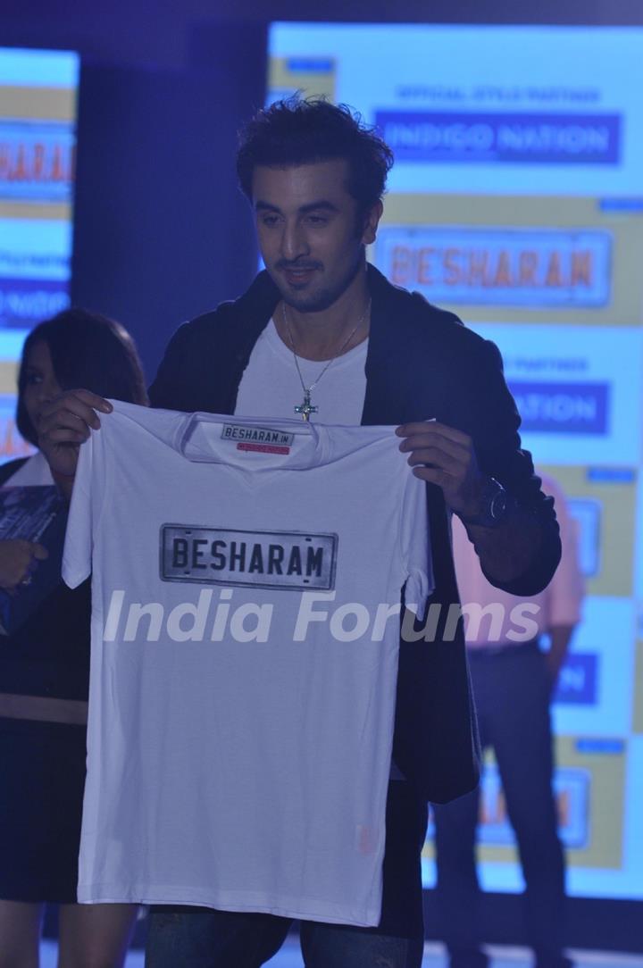 Ranbir Kapoor holds up the 'Besharam' T-shirt at the event