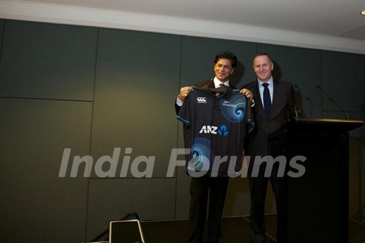 Shahrukh Khan presented with an official New Zealand Black Caps cricket T-shirt