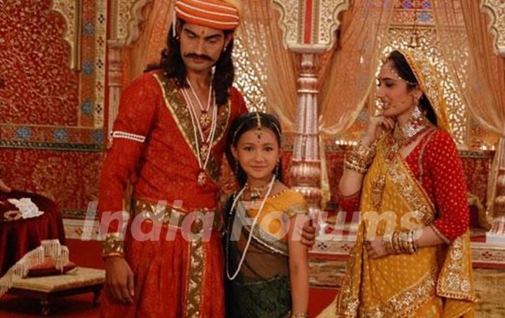 Meera with their parents