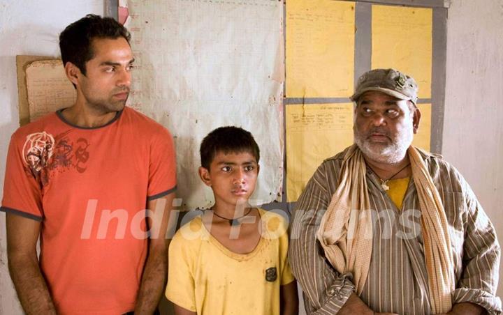 A still image of Abhay Deol and Satish Kaushik