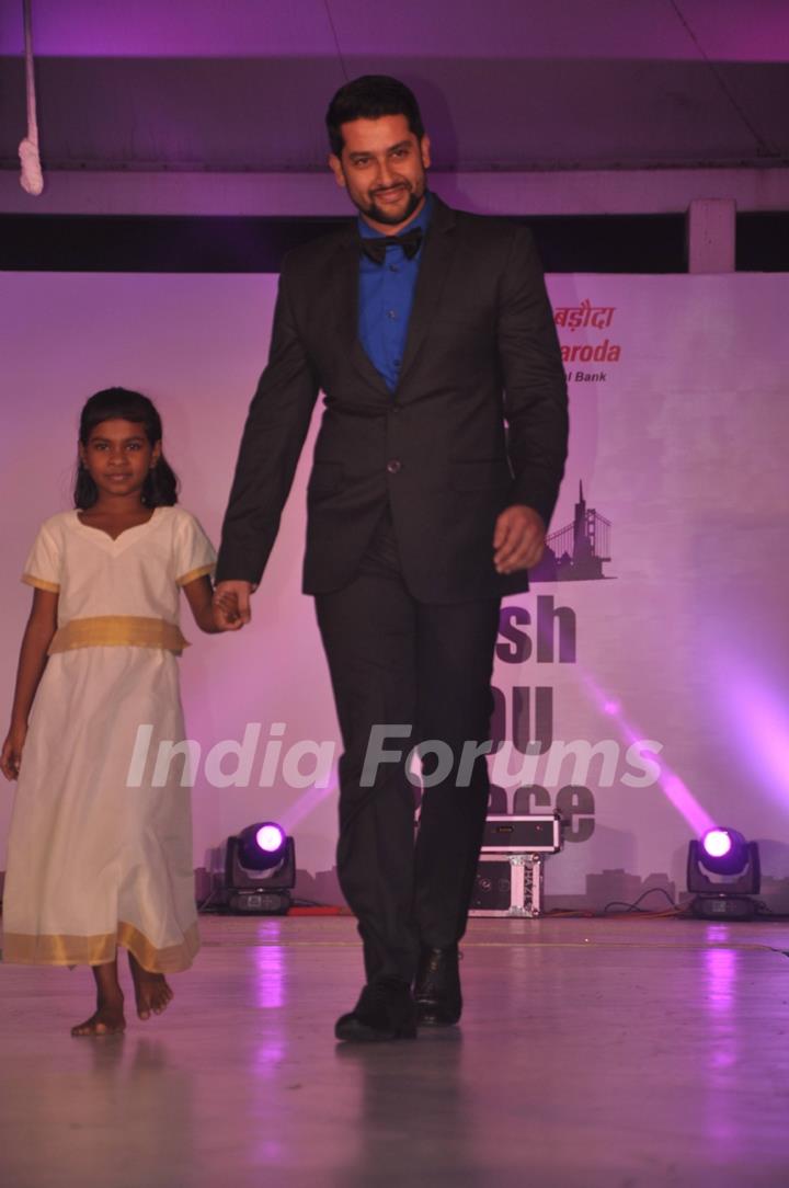 Celebs walk the ramp at the Peace Walk ramp show by designer Rajat Tangri at Welingkar College in Mumbai