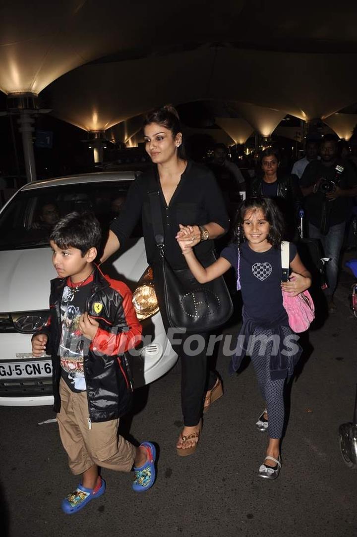 Raveena Tandon with her children clicked at the airport on 2nd Jan. 2014