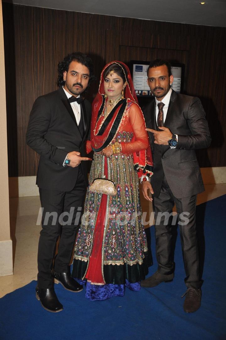 Toshi Sabri with his wife at their Reception Party along with Sharib Sabri