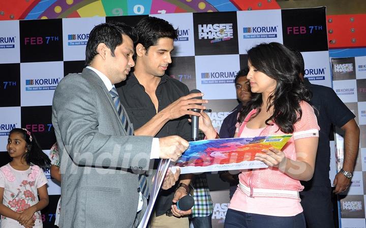 Sidharth Malhotra and Parineeti Chopra sign the autograph book at the Promotions of Hasee Toh Phasee