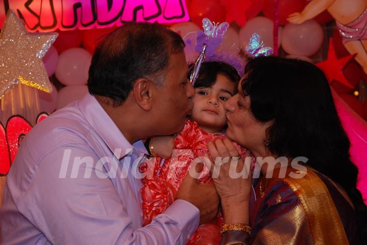 Samairra with her grand parents at her birthday party