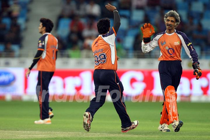 The Veer Marathi team celebrates a wicket taken