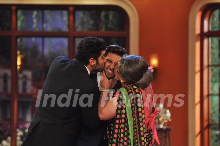 Arjun Kapoor and Ali Asgar plant a kiss on Ranveer Singh