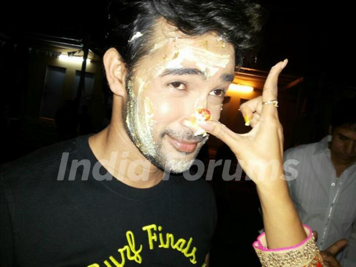 Karan Shrama's Birthday cake over his face