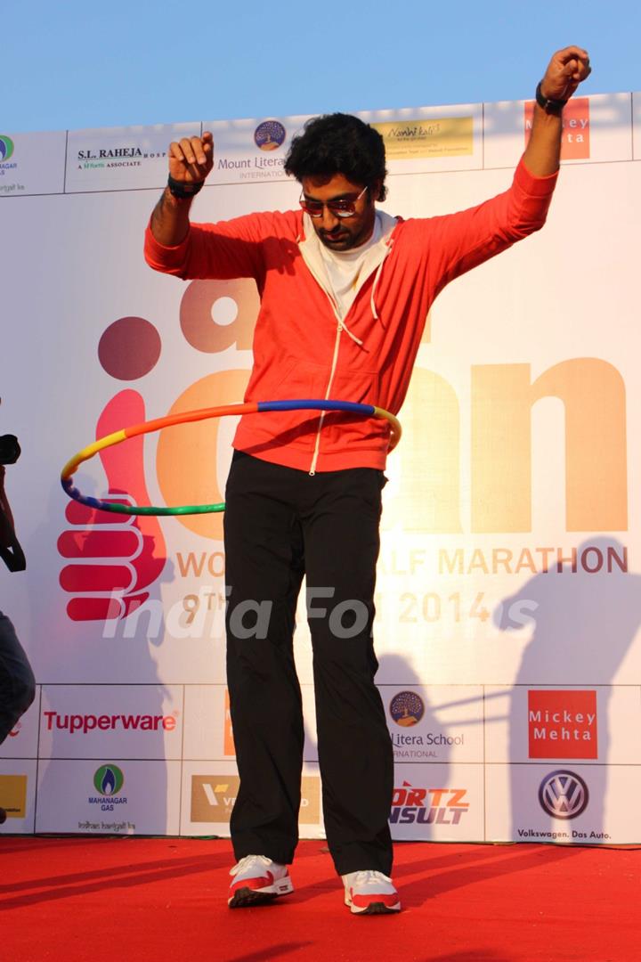 Abhishek Bachchan uses a hoolahoop at the Women's Half Marathon