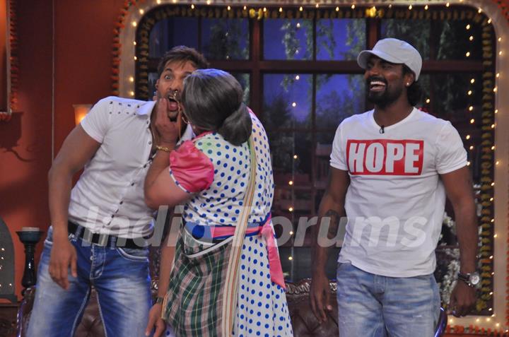 Dadi plants a kiss on Terence, while Remo watches this time