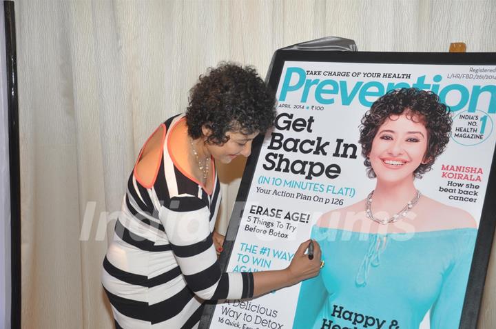Manisha Koirala signs the cover of health magazine Prevention