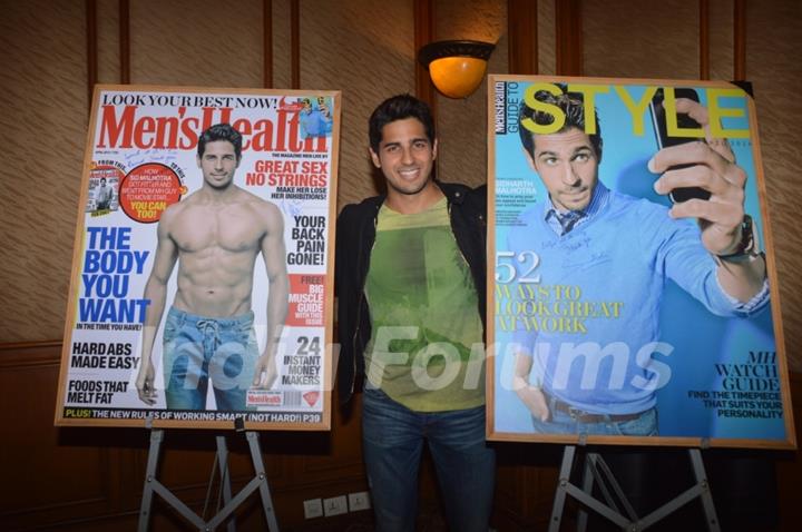 Sidharth Malhotra poses alongsidethe cover of Men's Health and Style