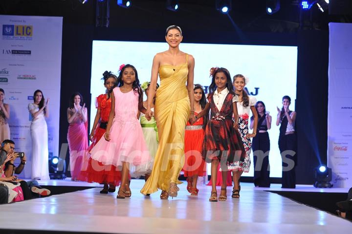 Sushmita Sen walks the ramp at the charity fashion show 'Ramp for Champs'