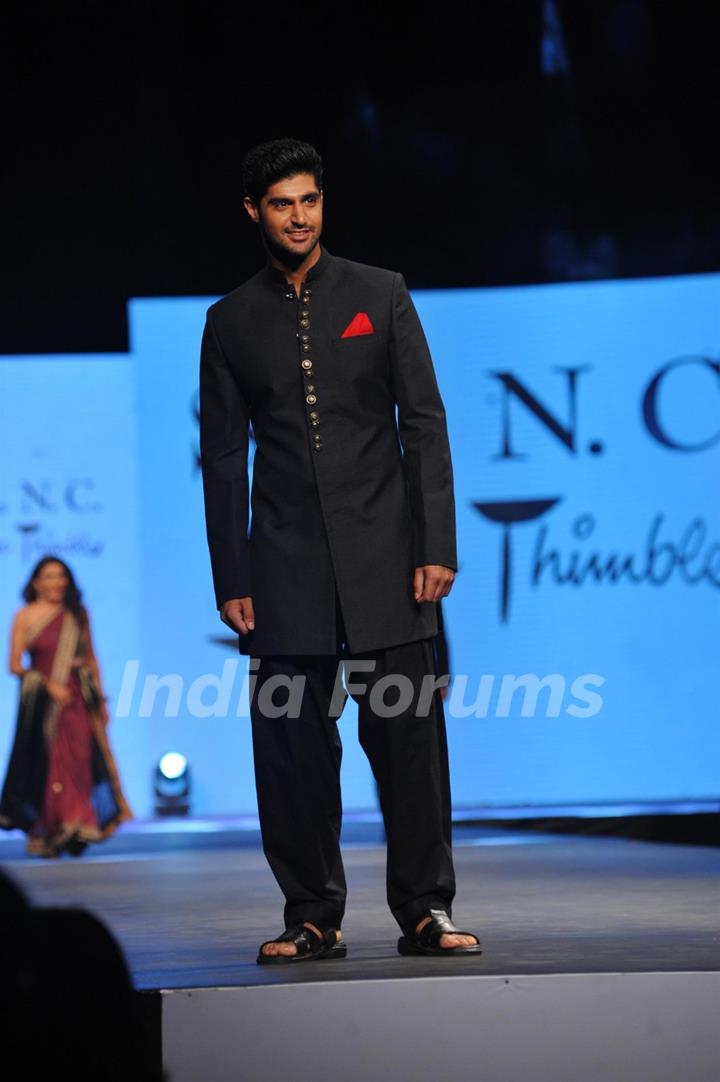 Tanuj Virwani walked the ramp at the 'Caring with Style' fashion show at NSCI